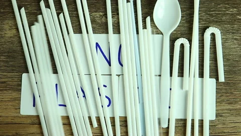 Moving  plastic  straw  by hand   and  reveal    no plastic word on board Stock Footage 134032701