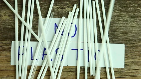Moving  plastic  straw  by wind   and  reveal    no plastic word on board Stock Footage 134032732
