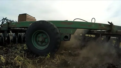 Moving plow on the field. Slow motion. Stock Footage 88339323