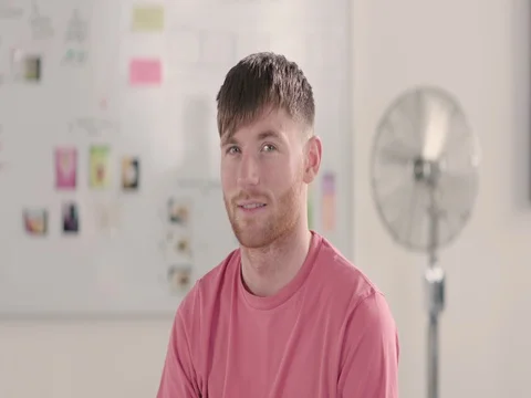 Moving portrait of a man in a startup office - track left. Stock Footage 72833949