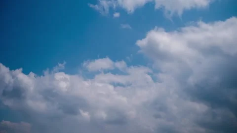 Moving Puffy Clouds Against Blue Sky Timelapse Stock Footage 318357637