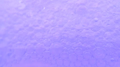 Moving purple bubbles background. Cosmetic micellar cleanser in lavender co.. Stock Footage 275069718