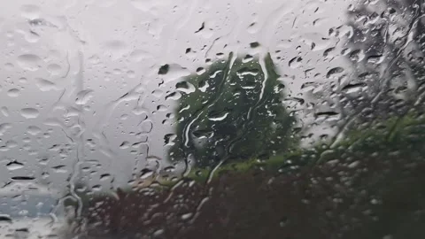 Moving rain drops on a car windshield Stock Footage 275275835
