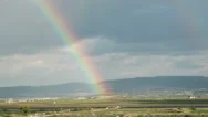 Moving Rainbow Over The Fields Of Galilee, Israel With Sun Rays Stock Footage