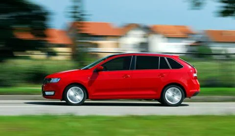 Moving red car Stock Photos