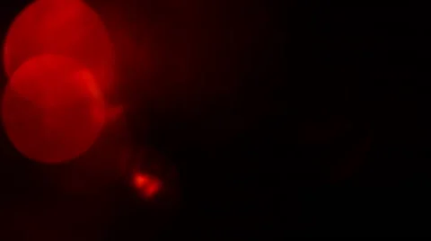 Moving red defocused lights. Dark background loop. Stock Footage 64337730