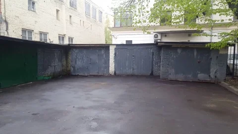 Moving From Right to Left View of Grey Garages Under Snow. Video stock 75815546