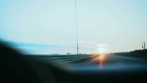 Moving road and sunset through the windshield of the car. Stock Footage 88554646