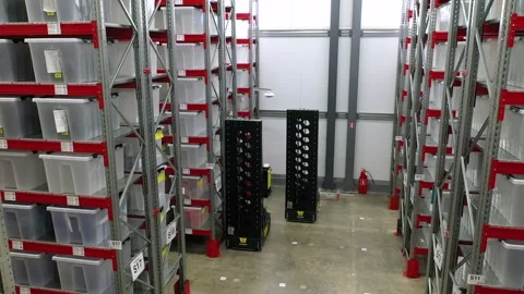 Moving robot in warehouse with containers Stock Footage 201717680