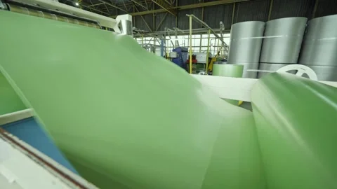 Moving roller with flat polyethylene green film Stock Footage 148437828