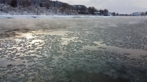 Moving at the same speed as ice floating down the Yellowstone River Stock-Footage 310576814