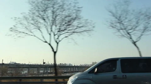 Moving scenery seen through the windows of a vehicle at Seoul, South Korea Stock Footage 105507936