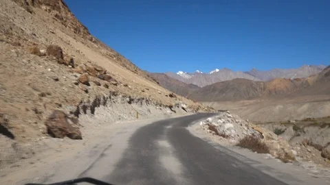 Moving scenery seen through the windows of a vehicle at Leh Ladakh, India Stock Footage 106111046