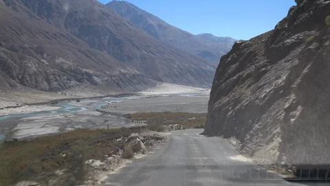 Moving scenery seen through the windows of a vehicle at Leh Ladakh, India Stock Footage 106120100