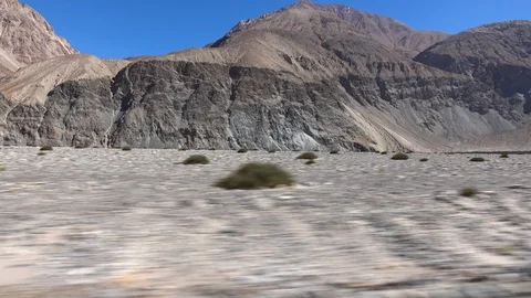 Moving scenery seen through the windows of a vehicle at Leh Ladakh, India Stock Footage 106121664