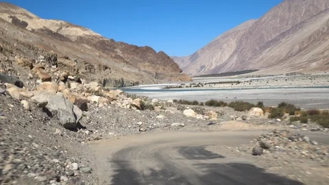 Moving scenery seen through the windows of a vehicle at Leh Ladakh, India Stock Footage 106121953
