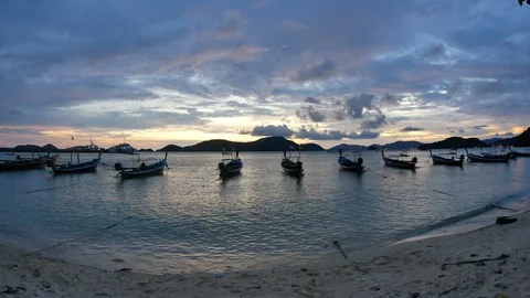 Moving sea wave water at sandy beach and moving thai flag on long tail boat t Stock Footage 101404702