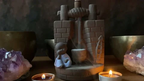 Moving sequence of a cascading incense burner. Stock Footage 225878586