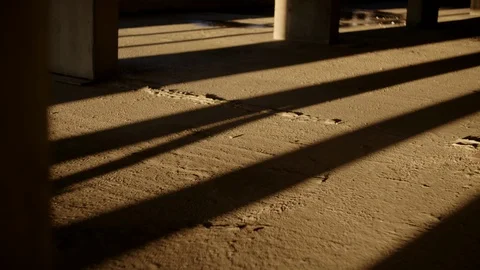 Moving shadow on the floor of empty building Stock Footage 128326477