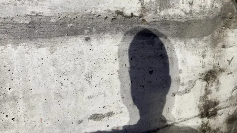 Moving Shadow of a Head Stock Footage 249697591