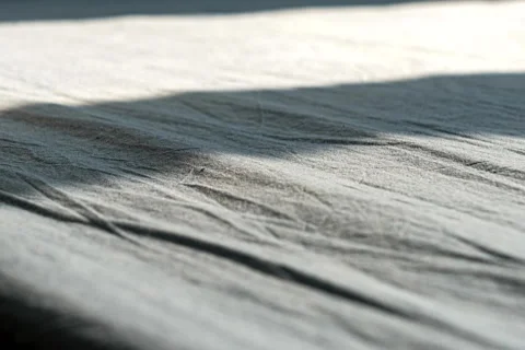 The Moving Shadow of Sunbeam Falling on Bed in the Morning Stock Footage 224307208
