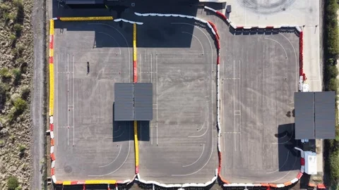 Moving shadows over empty karting race track Stock Footage 339304431