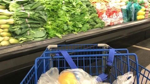 Moving Shopping Cart With Grocery Through Produce Aisle Stock Footage