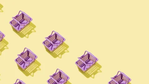 Moving shopping carts on colored background, animated video sales concept Stock Footage 239535479