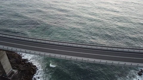 Moving shot of a bridge and ocean with a drone Stock Footage 143620439