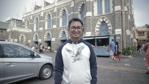 A moving shot of a bright and smiling young man Stock Footage 85773995