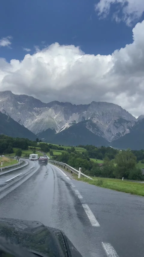 Moving shot of a car driving in Alpine mountain area in Austria 動画素材 284463079