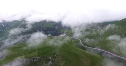 Moving shot from the clouds above the beautiful mountains Video stock 129251734