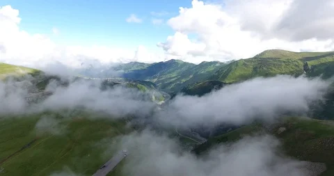 Moving shot into the clouds above the ravine and magic mountains Video stock 129252002