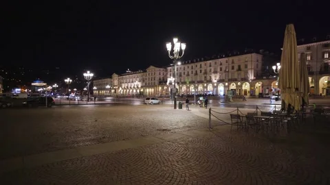 Moving shot of an empty and illuminated square at night 스톡 동영상 235397687