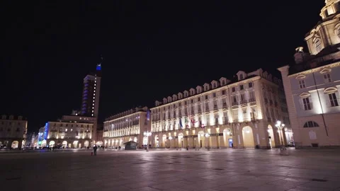 Moving shot of an empty and illuminated square at night Stock Footage 235398285