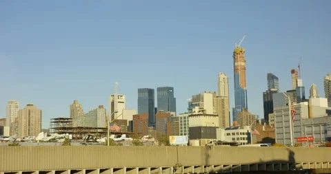 Moving Shot Of Iconic New York Skyline In Classic Manhattan With Moving US Flag Stock Footage 112192032