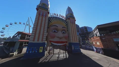 Moving shot of the iconic smiling face entrance of Syndey Luna Park Video stock 248509279