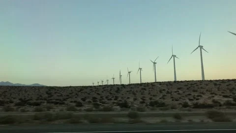 Moving Shot Past Field of Windmills/Wind Turbines Vídeo Stock 101142813