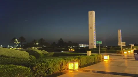 Moving shot past Sheikh Zayed Grand Mosque beautifully illuminated in blue Stock Footage 340256080