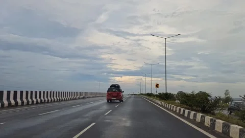 Moving shot of red car overtaking on highway capturing smooth motion and sc.. Stock Footage 336365841