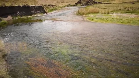 Moving shot of river and distant mountains, horizontal format Stock Footage 255983707