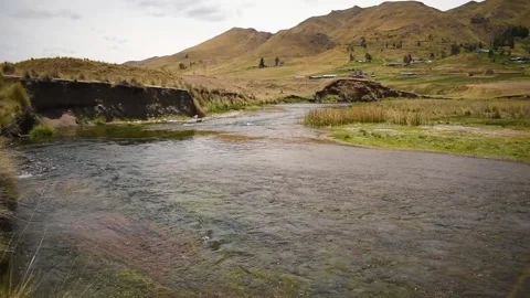 Moving shot of river and distant mountains, horizontal format Stock Footage 255983711