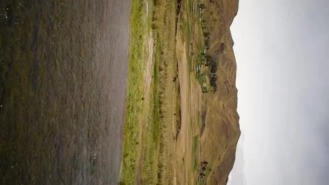 Moving shot of river and distant mountains, horizontal format Stock Footage 255983712