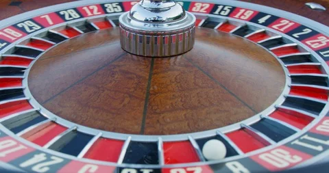 Moving shot of a roulette wheel as it is continuously spinning. Stock Footage 121742700