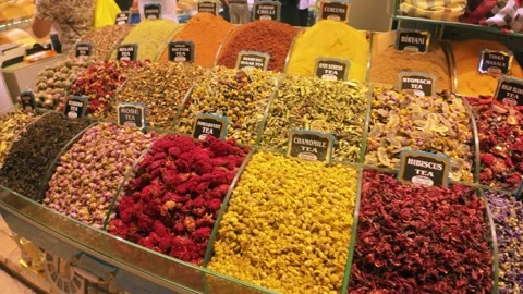 A moving shot showing various kinds of teas, dry fruits and spices at a bazar Stock Footage 296499457