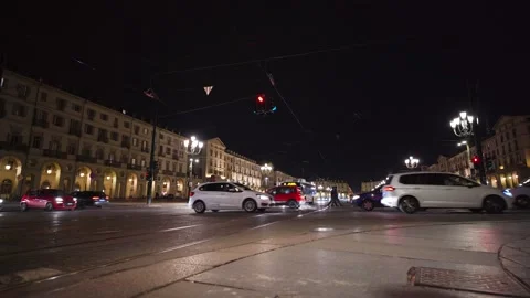 Moving shot of a square with traffic at night Stock Footage 235399050