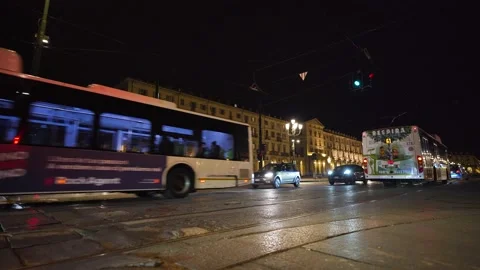 Moving shot of a square with traffic at night Stock Footage 235399700