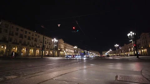 Moving shot of a square with traffic stopped at the traffic lights Stock Footage 235399220
