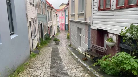 Moving shot through a quiet rainy street in the historic center of Bergen Stock Footage 331872229