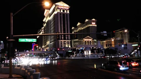 Moving shot of traffic passing Caesars Palace in Las Vegas Stock Footage 106621830